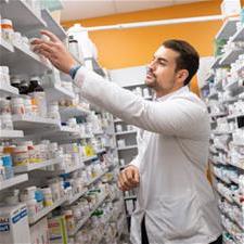 Student stocks pharmacy shelf